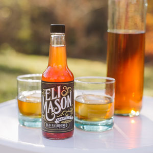Eli Mason Old Fashioned mixer with cocktails outdoors